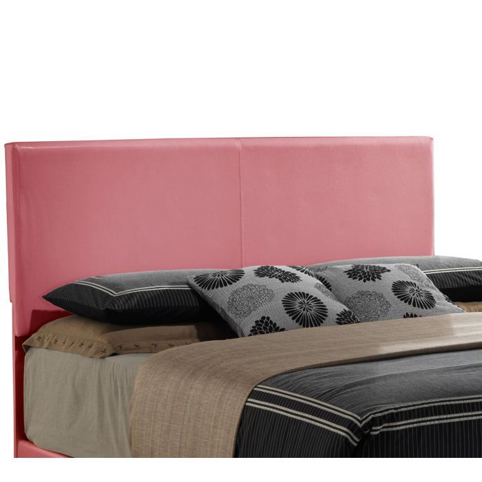 The Elegant Platform Bed For Relaxed Spaces features a large pink upholstered headboard and is neatly made with gray, black, and beige bedding plus black-and-white floral decorative pillows.