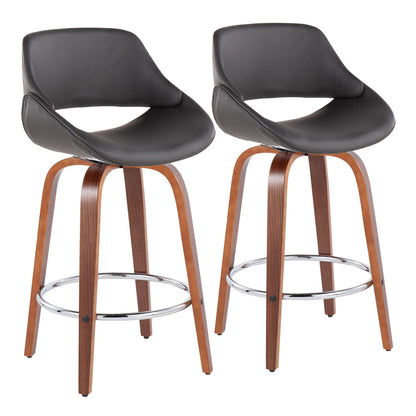 The Fabrico set includes two mid-century modern counter stools, each with curved wooden legs, a round metal footrest, and black faux leather cushioned seats featuring low, rounded backs.