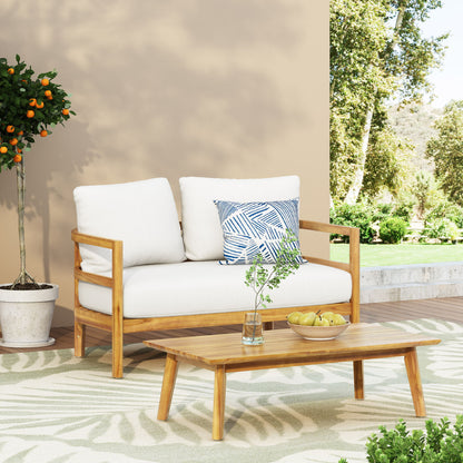 The Outdoor Furniture With Coffee Table, Patio Conversation Set Deep Seating With Soft Cushion is arranged on a patio near a potted orange tree, with lush greenery in the background and a glass vase and apples on the coffee table.