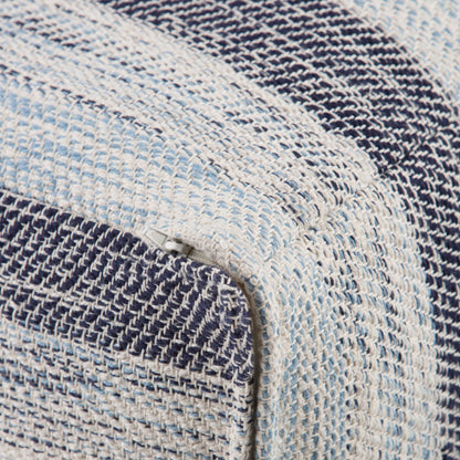 Close-up of the Clay - Square Pouf, Upholstered, featuring a woven fabric with blue, white, and light blue stripes. A small zipper is visible along the corner seam.