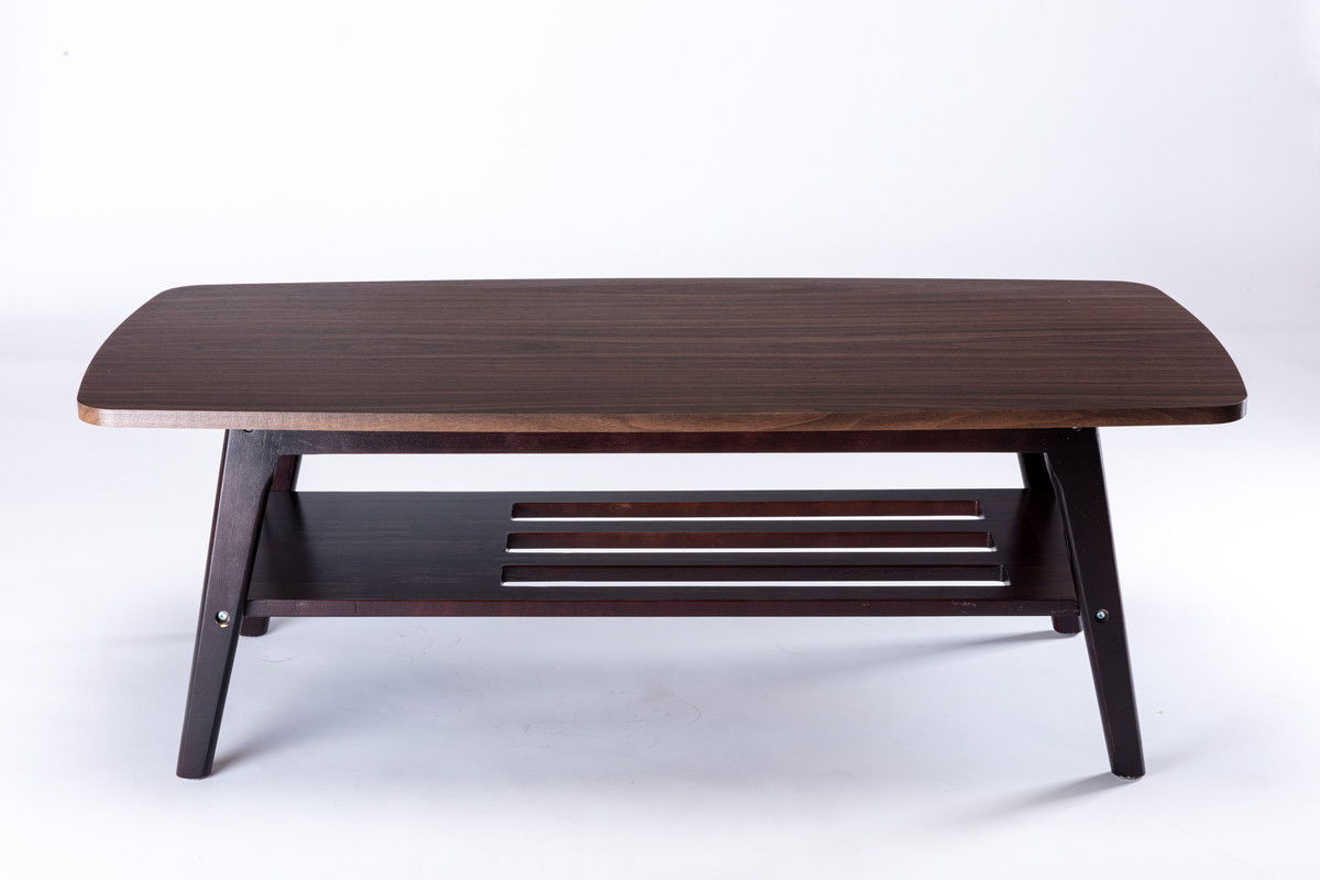 The Bahamas - Living Room Set features a rectangular dark wood coffee table with angled legs and a lower slatted shelf, showcased against a plain white background.