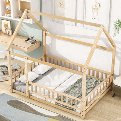 The Floor Wooden Bed With House Roof Frame and Fence Guardrails, dressed in white bedding with a green blanket, is placed in a bright, cozy kids' room decorated with animal artwork and soft toys.