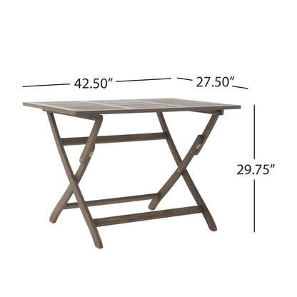 The Blissique Outdoor Foldable Wood Dining Table features a brown slatted rectangular top, crossed legs, and measures 42.5"W x 27.5"D x 29.75"H.