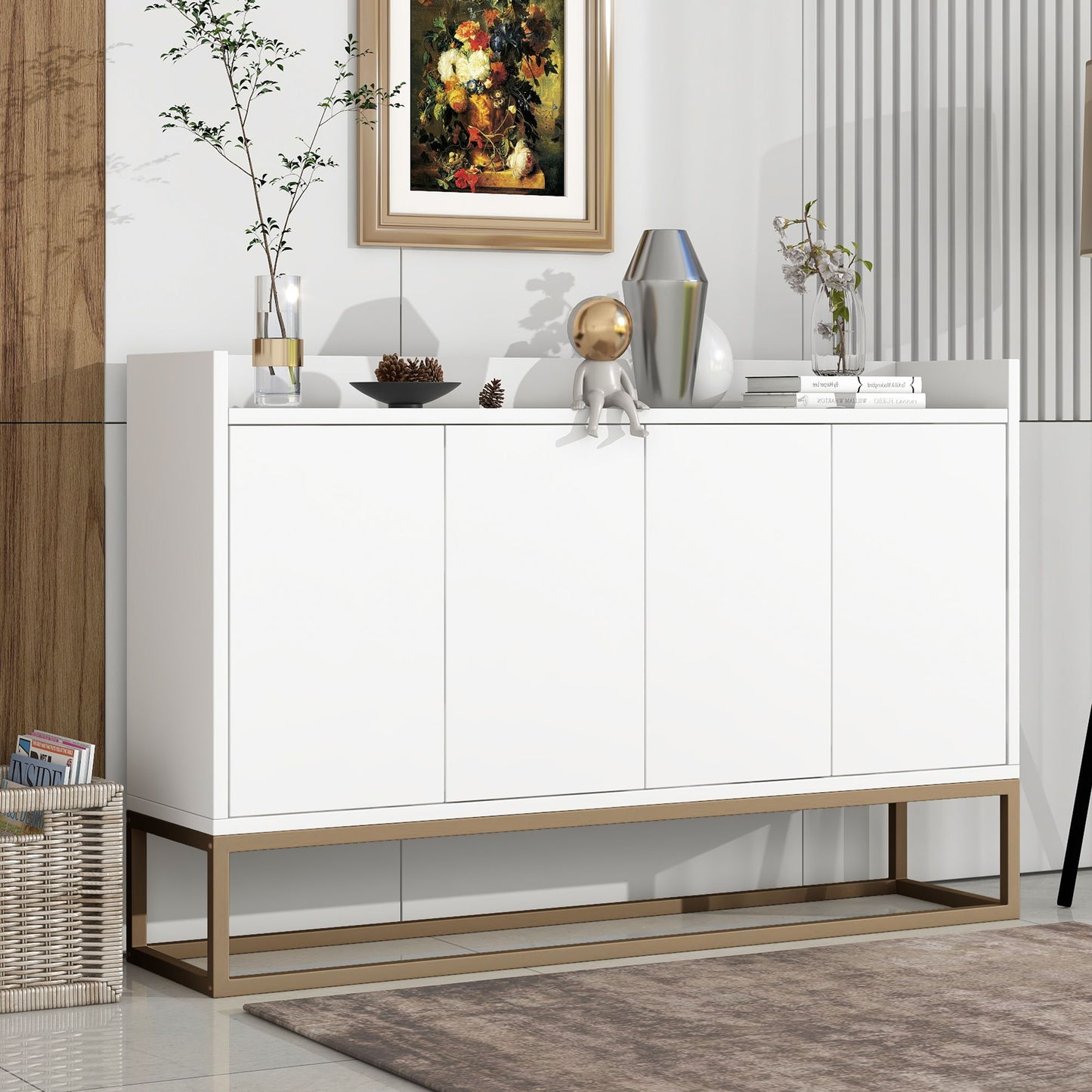 The Modern Sideboard Elegant Buffet Cabinet With Large Storage Space for Dining Room or Entryway stands by the wall, topped with vases, a plant, a figurine, and books. Framed art hangs above; a basket rests on the floor nearby.