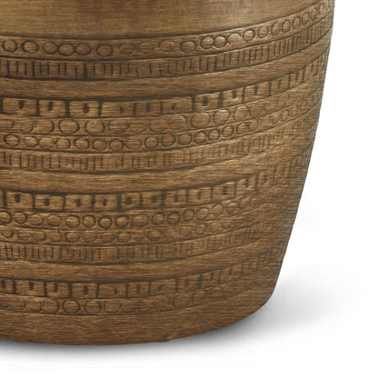 A close-up of the Johnsen - Handcrafted Large Metal Accent Table, featuring bronze-toned metal with horizontal etched circular and rectangular patterns for a decorative, rustic look.