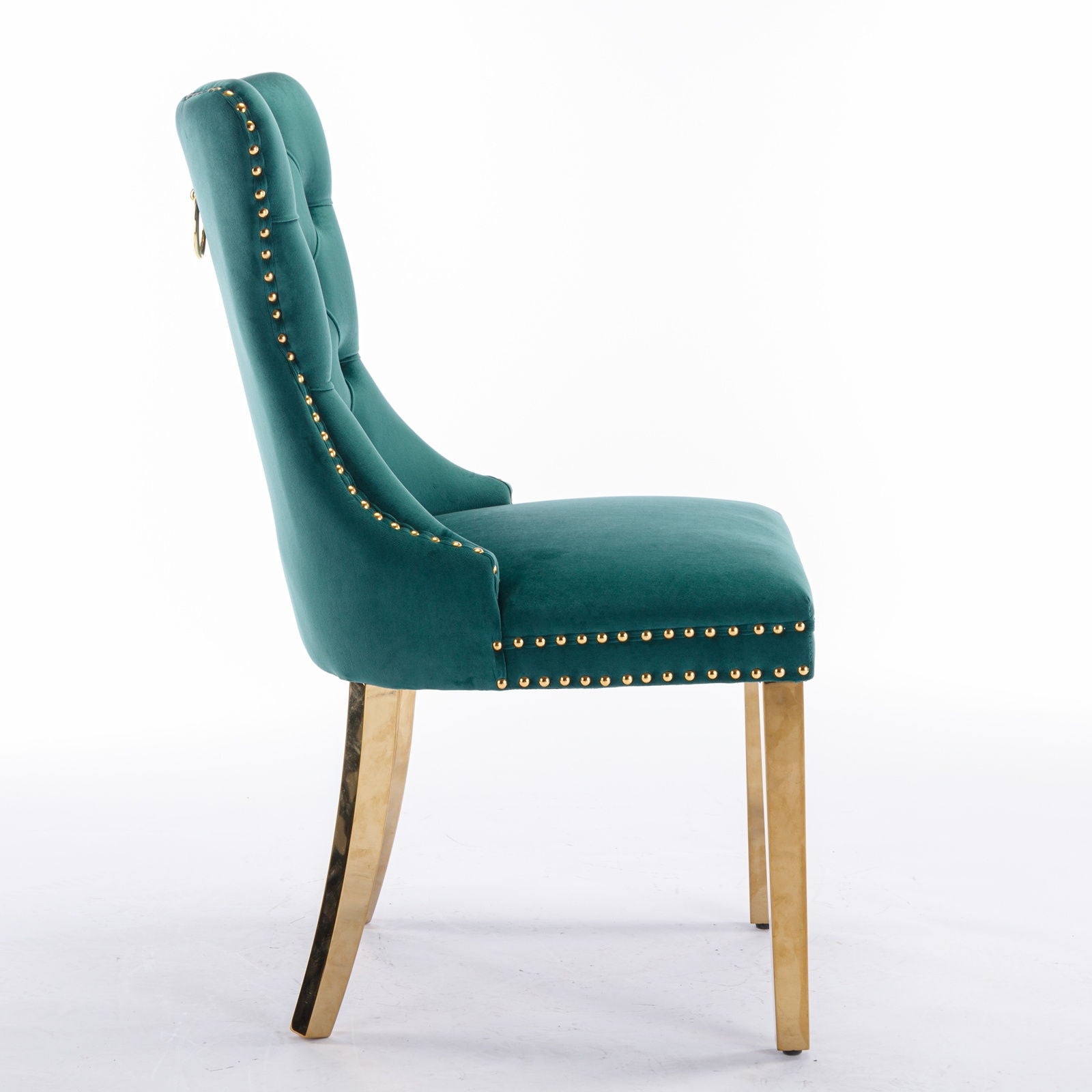 The Nikki chair set features a teal velvet upholstered design with a tufted backrest, gold nailhead trim, and golden stainless steel-plated legs. A chic ring pull accents the upper back. Shown in side view against a plain white background.