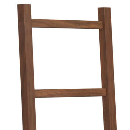 A close-up of the upper section of the Bray Bath Towel and Blanket Ladder Shelf in natural walnut, featuring two vertical rails and two horizontal rungs made from smooth, brown wood.