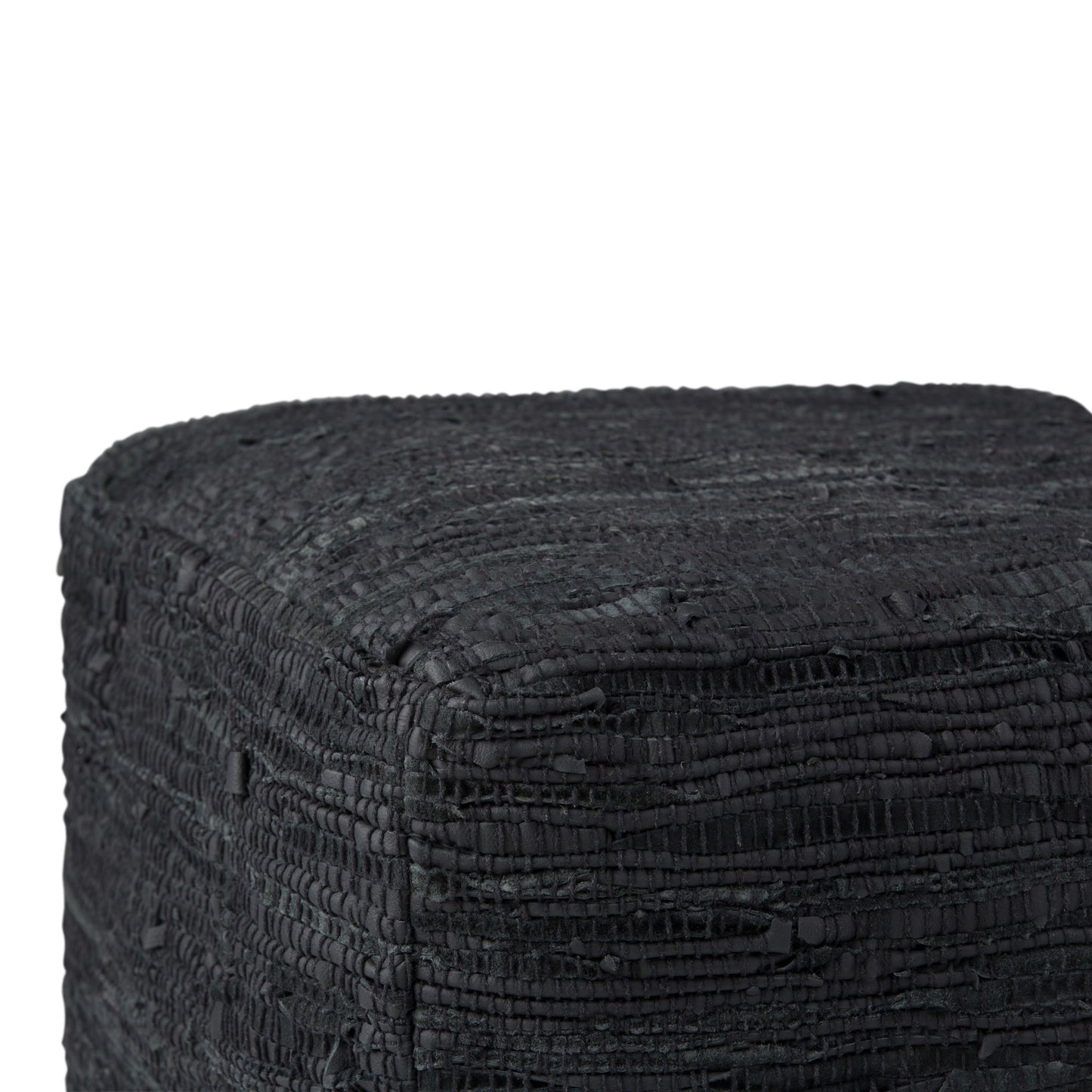 Close-up of the Fredrik - Handcrafted Square Pouf, featuring a textured, black, woven surface. The image shows only the top and two sides of this stylish and unique cube-shaped pouf.