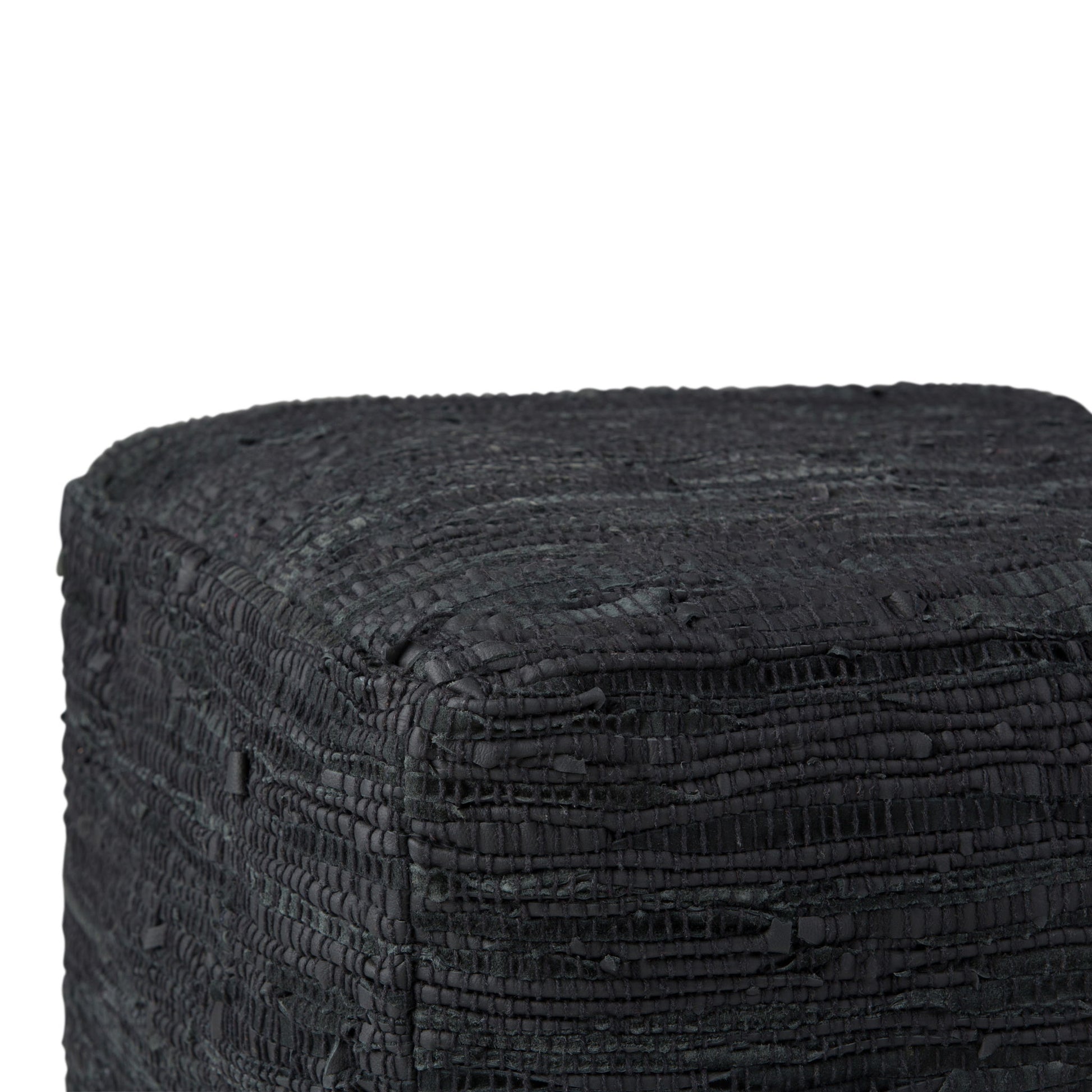 Close-up of the Fredrik - Handcrafted Square Pouf, featuring a textured, black, woven surface. The image shows only the top and two sides of this stylish and unique cube-shaped pouf.