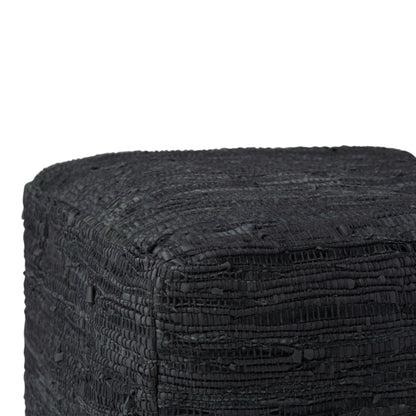 Close-up of the Fredrik - Handcrafted Square Pouf, featuring a textured, black, woven surface. The image shows only the top and two sides of this stylish and unique cube-shaped pouf.