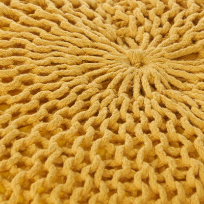 Close-up of the Bordeaux Knitted Cotton Round Pouf, a yellow hand-knitted ottoman and floor cushion featuring a circular radial pattern with thick, textured yarn.
