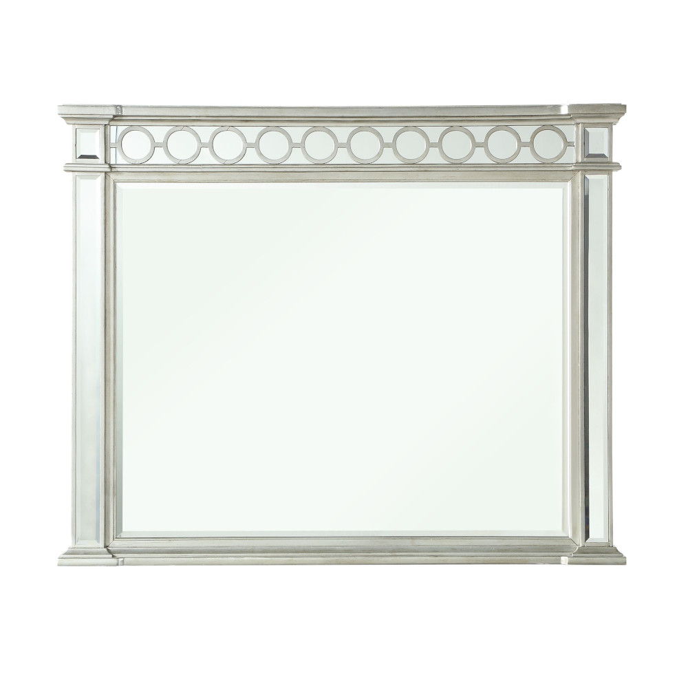 The Varian - Mirrored Designed Mirror in silver features a rectangular frame with decorative circular accents along the top edge, displayed against a white background.