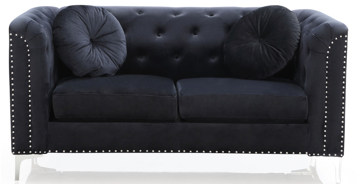 The Stylish Sloped Arm Loveseat features black velvet upholstery, silver nailhead trim on the arms and base, two matching round black pillows, and clear acrylic legs.