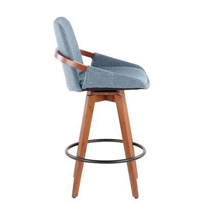 Side view of the Cosmo - Mid Century Counter Stool featuring a blue upholstered seat and backrest, wooden legs, and a circular black metal footrest.