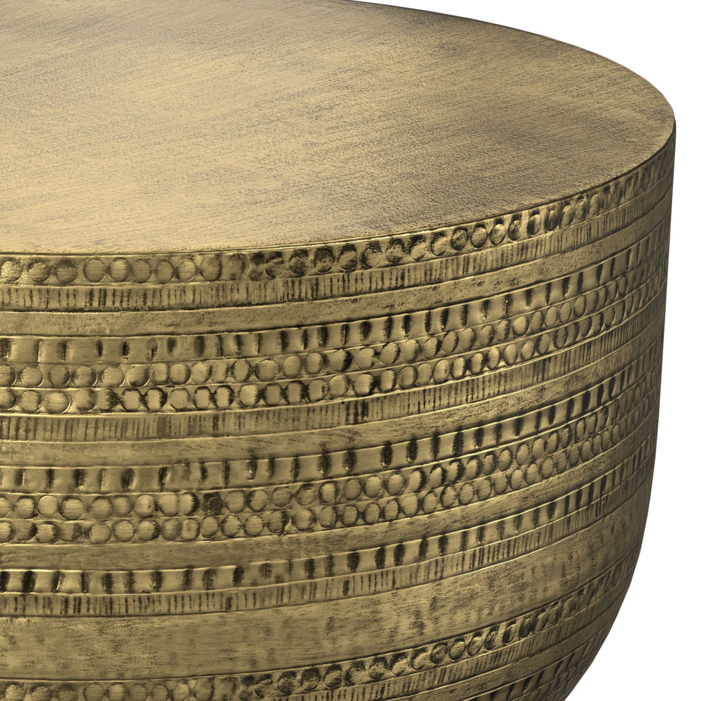 Close-up of the Johnsen - Handcrafted Metal Coffee Table, showcasing its round metallic gold surface with textured, engraved patterns of horizontal rows of small dots and lines.
