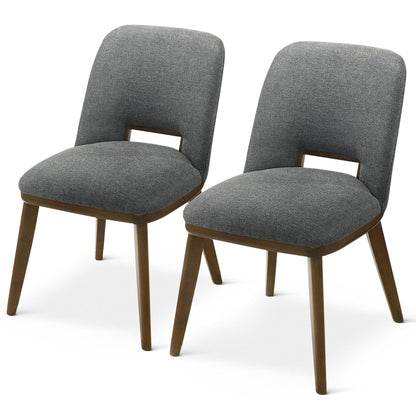 The Blake - Modern Dining Chair (Set of 2) features gray upholstered seats and backs with a small open gap at the base of the backrest, complemented by angled wooden legs in a medium brown finish.