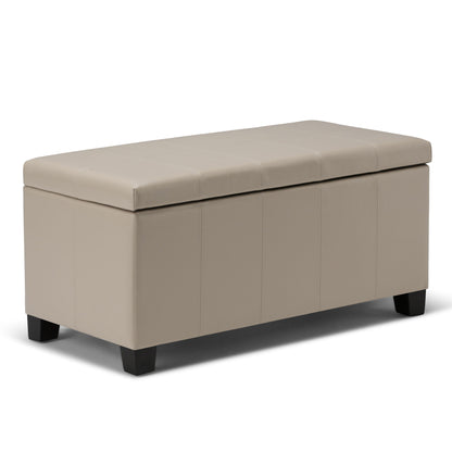 The Dover Upholstered Storage Ottoman Bench features a rectangular beige design with a cushioned lid and short black legs, shown on a white background.