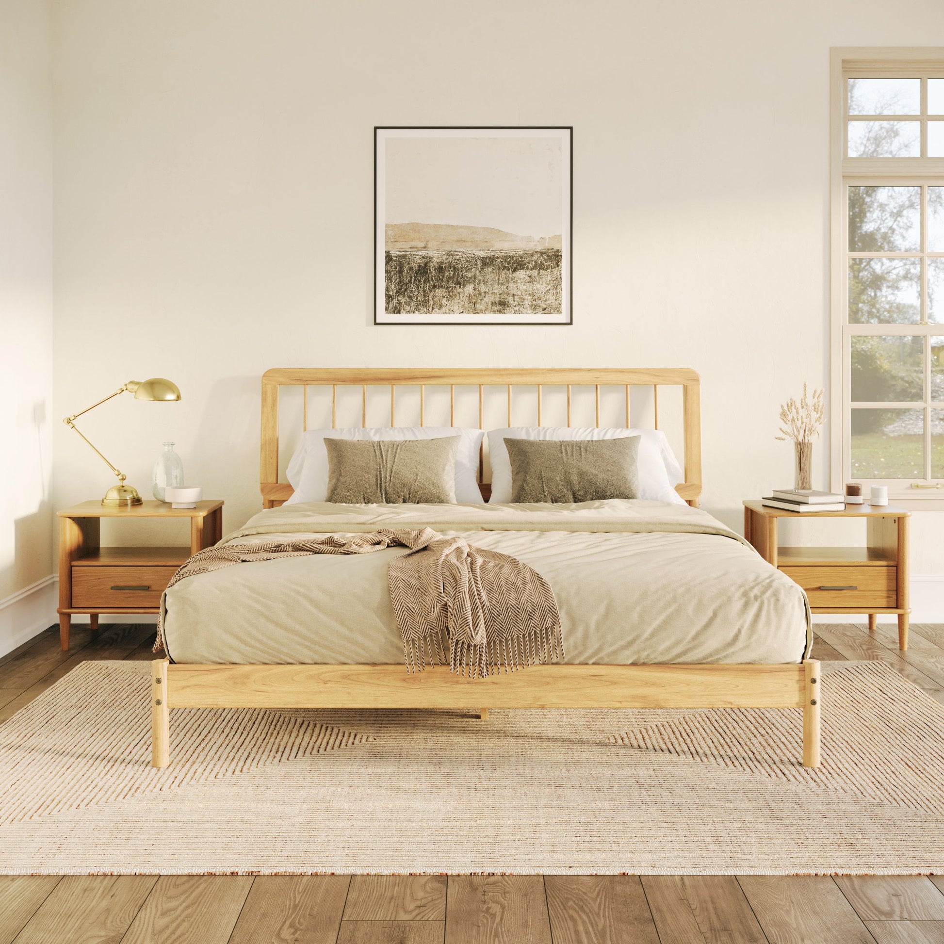A cozy bedroom features the Mid-Century Modern Solid Wood Spindle Bed with beige bedding, green accent pillows, a brown throw, matching nightstands and lamps, a neutral rug, a large window, and landscape artwork above the bed.