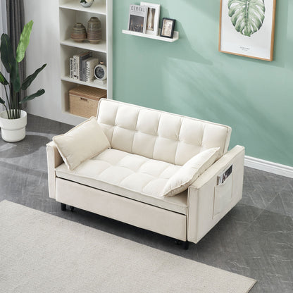 The Modern Velvet Sofa 3-in-1 Convertible Sleep Sofa Bed with a pillow and side pockets sits on a gray floor by a beige rug, next to a green wall accented with plants, artwork, and white shelves.