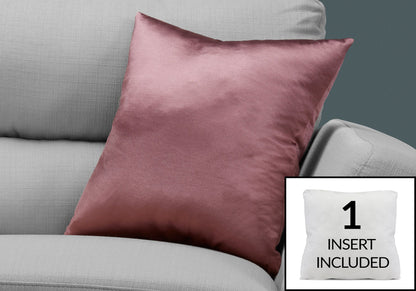 A modern pink satin decorative throw pillow rests on a light gray sofa. An inset shows the included hypoallergenic square insert with the text "1 INSERT INCLUDED.