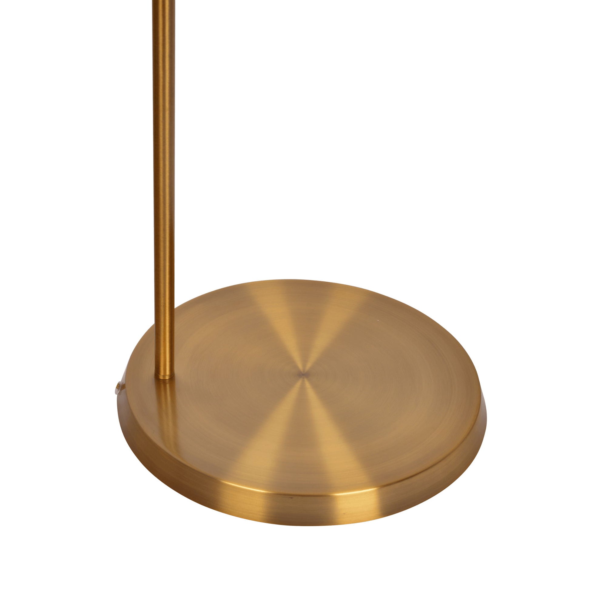 A close-up of the Zenith Offset Base Floor Lamp features a round, brushed gold base with a slim vertical pole on one side, set against a white background. The lamp includes a drum-shaped linen shade in gold and white.