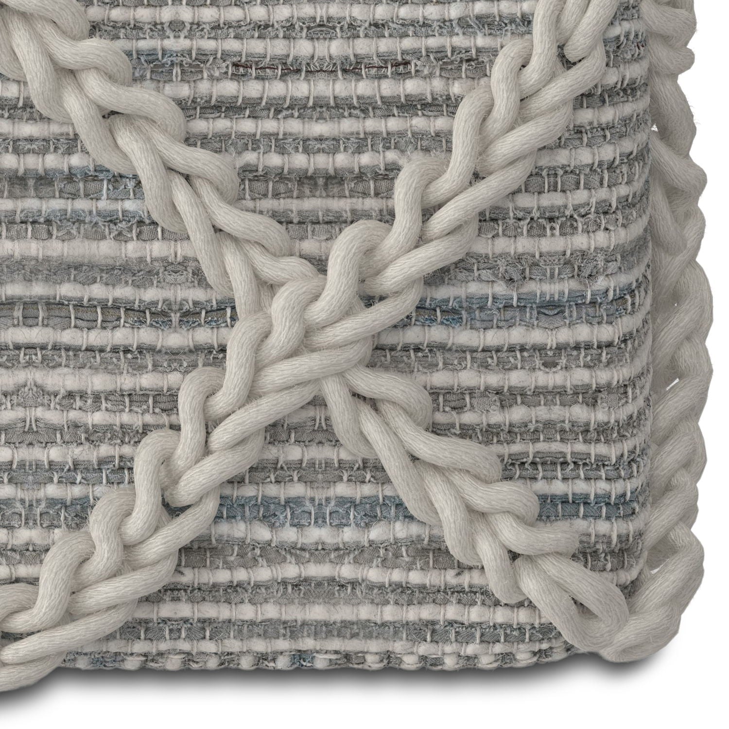 Close-up of the Cowan - Handcrafted Square Pouf, showing its textured fabric with horizontal gray and white stripes and thick, twisted cream-colored yarn forming an X pattern at the corner.