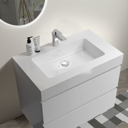 The Alice Bathroom Vanity features a wall-mounted, modern white design with a rectangular one-piece sink basin, large storage, and no faucet or drain included. Set against a light wall with geometric tile flooring and a round mirror above.
