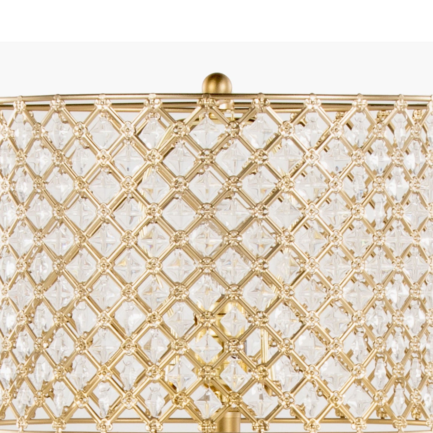 A close-up of the Topaz - Contemporary Table Lamp’s gold metal lampshade, featuring a diamond-patterned lattice design with clear crystal accents, highlights its intricate and decorative details.