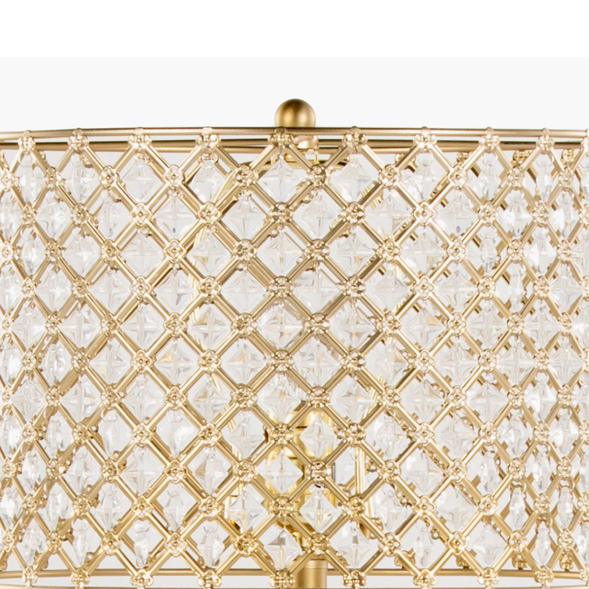 A close-up of the Topaz - Contemporary Table Lamp’s gold metal lampshade, featuring a diamond-patterned lattice design with clear crystal accents, highlights its intricate and decorative details.