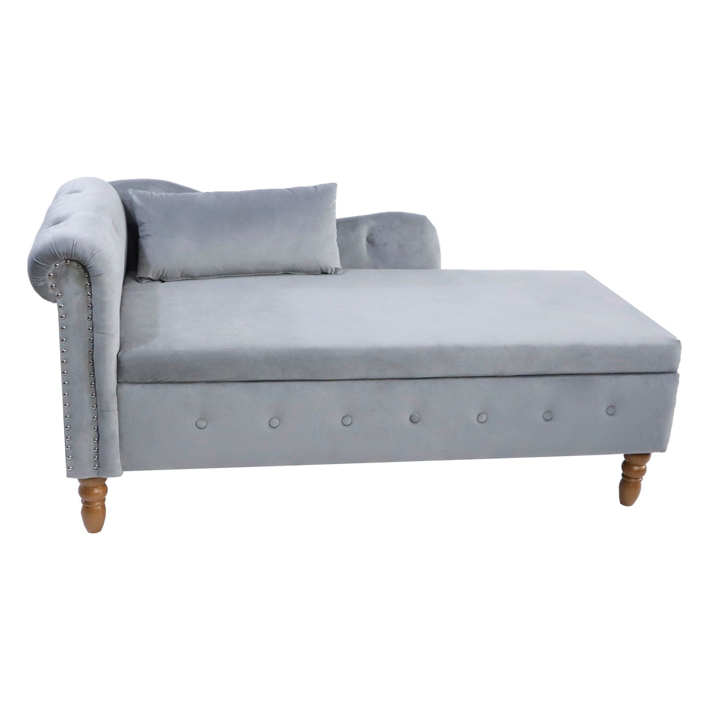 The Chaise Lounge Indoor is a modern velvet lounge chair with storage, a left rolled armrest, wooden legs, button tufted front, nailhead trim, and comes with a matching pillow—perfect for your bedroom, living room, or office.