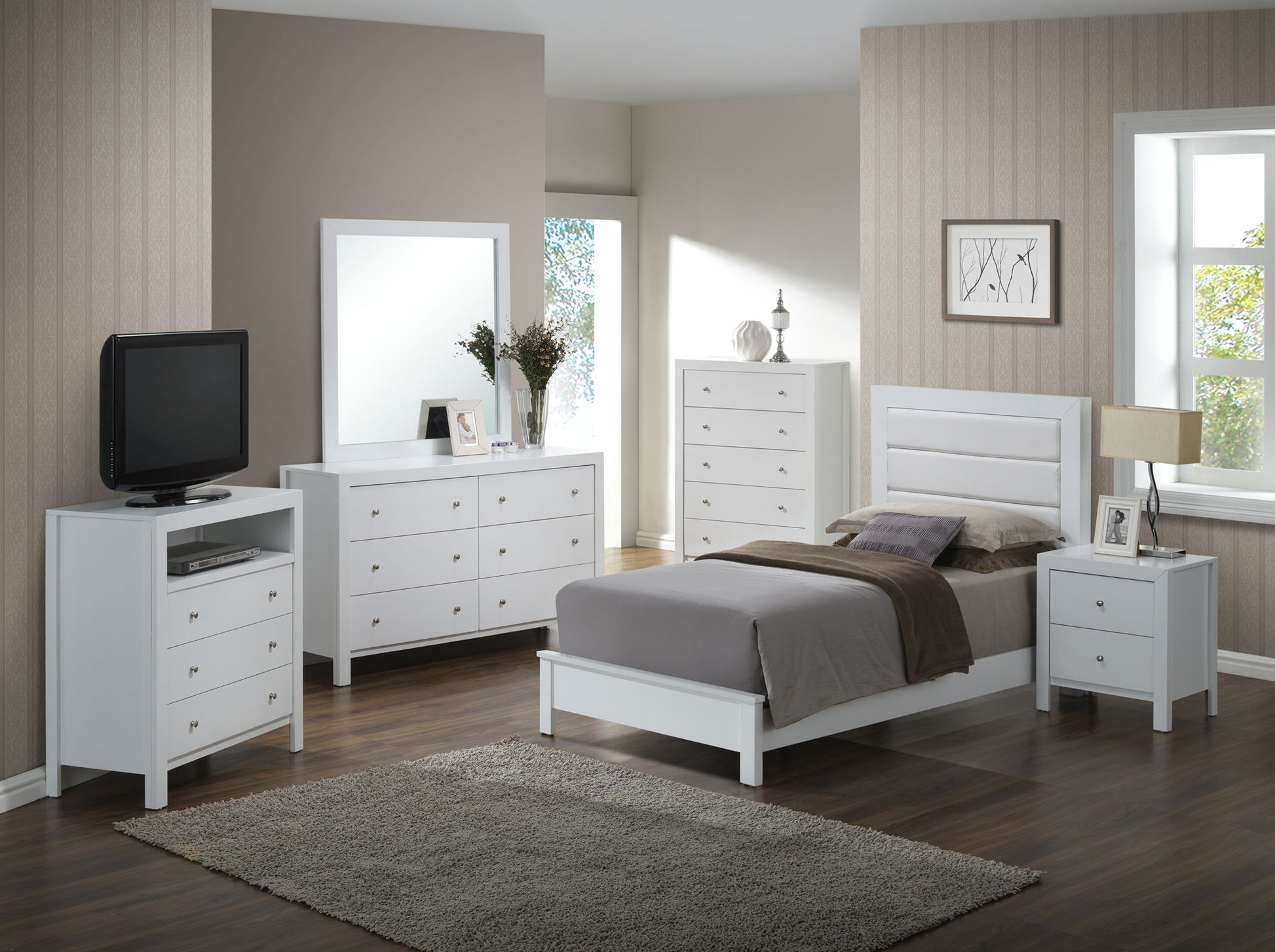 A modern bedroom features wood floors, neutral walls, a large window, a beige area rug, and white furniture including the Transitional Modern Design Bed, nightstand, dresser, TV stand, and chest of drawers.