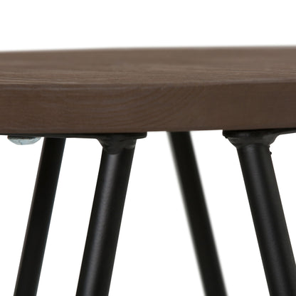 Close-up of the Simeon - Multifunctional Metal Stool With Wood Seat, highlighting the round wooden seat and the black metal legs securely attached underneath at key connection points.