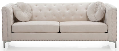 The Elegant Contemporary Sofa features light beige velvet upholstery, tufted design, two round cushions, metal legs, and nailhead trim on the armrests and base.