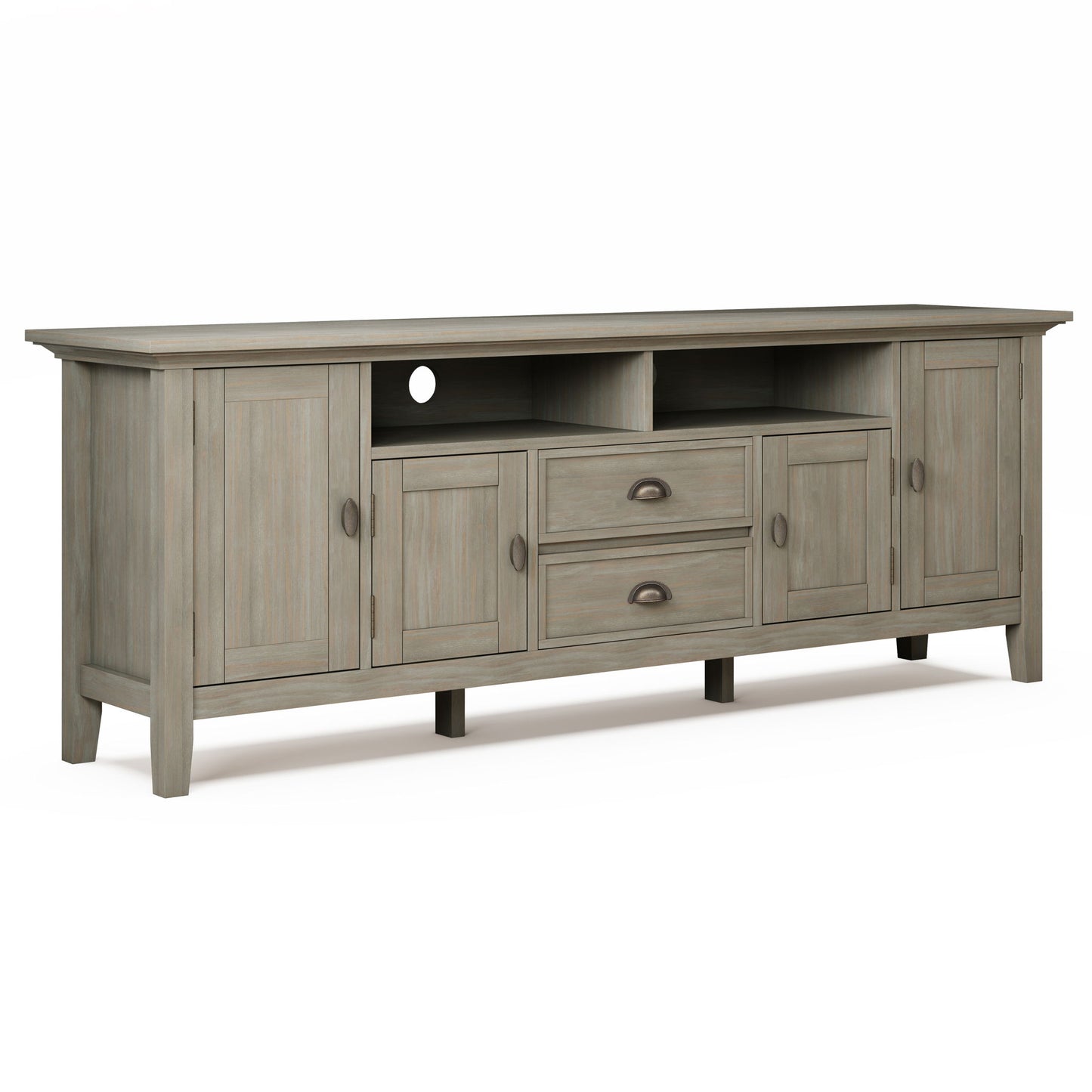 The Redmond Handcrafted TV Media Stand is a long, light gray wooden piece with four doors, two central drawers, two open shelves, a rear cable management hole, and dark round and cup-style handles.