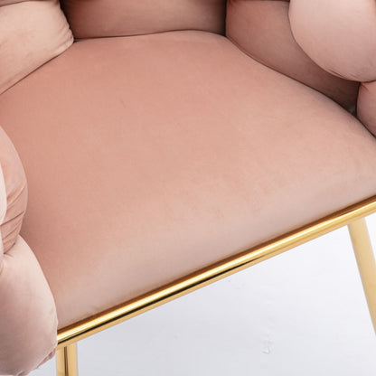 Close-up of the Luxury Modern Simple Leisure Velvet Single Sofa Chair in light pink, featuring cushioned armrests and a gold metal frame and legs, set against a white background. Ideal for bedroom, dresser, or manicure table use.