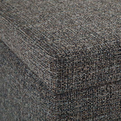 Close-up of the corner of the Avalon Storage Ottoman Bench in dark gray, featuring textured, speckled fabric and detailed weave on the upholstered surface.