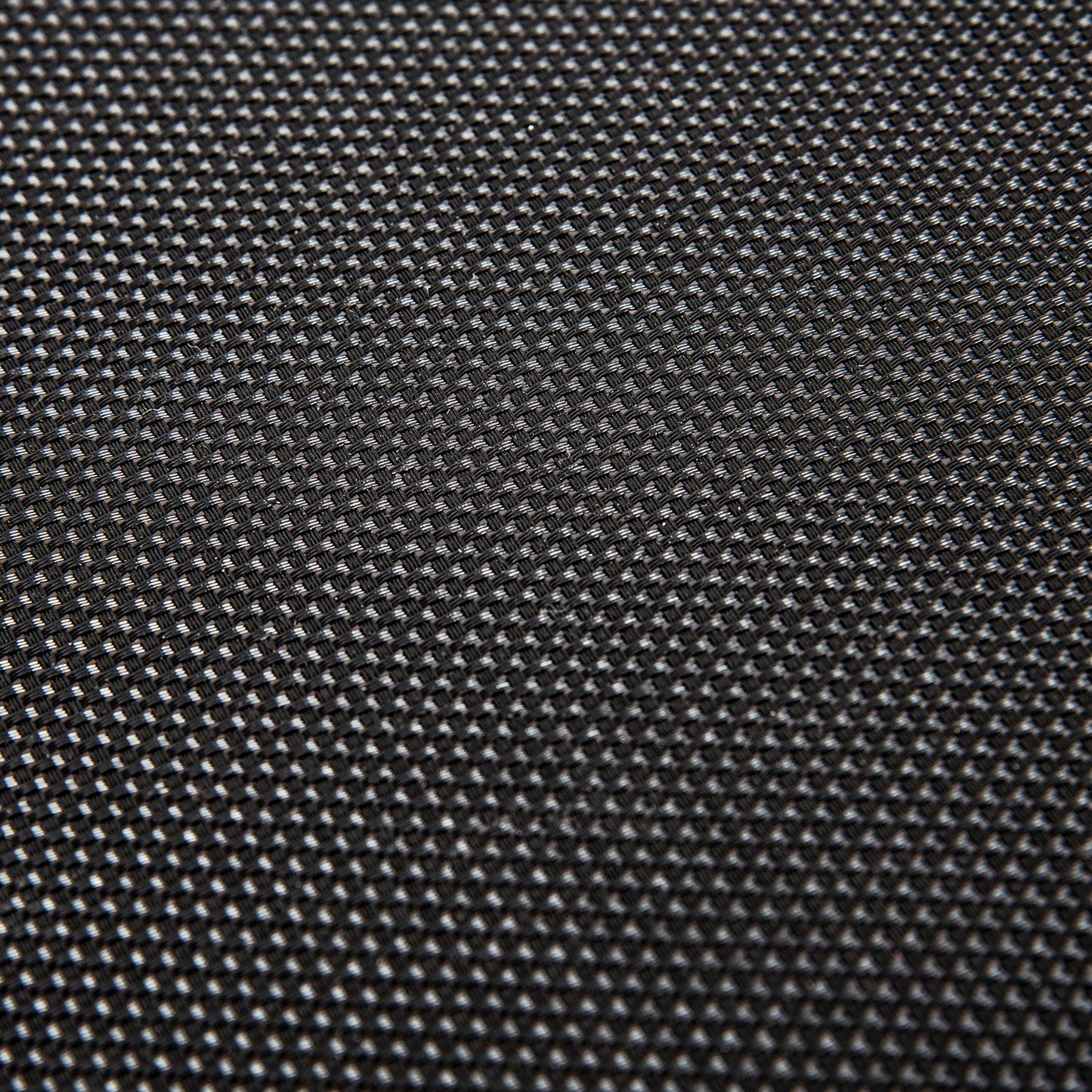 Close-up of the Kangle Store Trampoline With Handle's black, textured surface featuring a small, repeating grid pattern. Lighting accentuates the raised design, giving it a woven look and adding depth to the trampoline’s appearance.