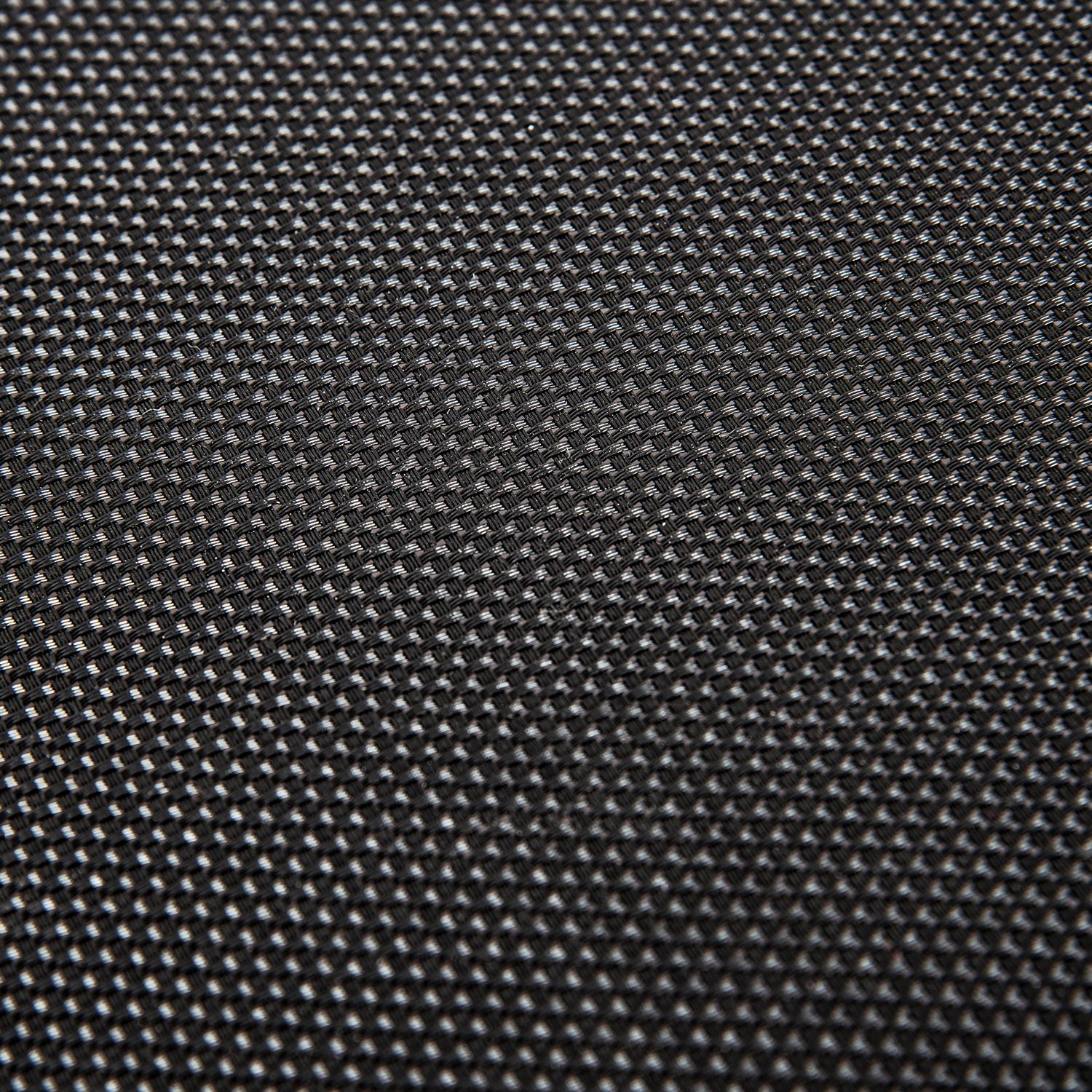 Close-up of the Kangle Store Trampoline With Handle's black, textured surface featuring a small, repeating grid pattern. Lighting accentuates the raised design, giving it a woven look and adding depth to the trampoline’s appearance.