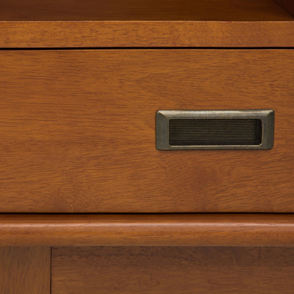 Close-up of the Draper - Mid Century Wide Bookcase And Storage Unit, highlighting its warm brown wood grain, metal label holder, and timeless, classic design.