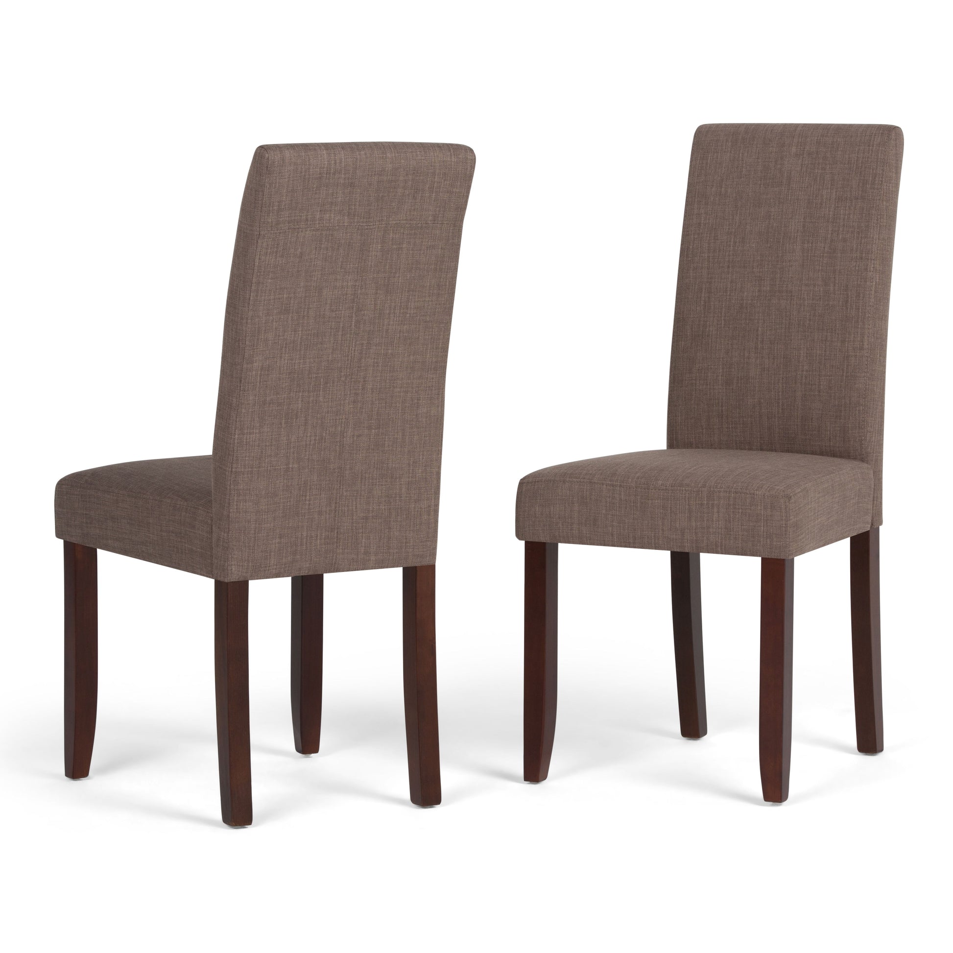 The Acadian Upholstered Parson Dining Chair (Set of 2) is shown in brown with dark wooden legs; one chair is front-facing while the other shows a side view, highlighting both angles of the design.