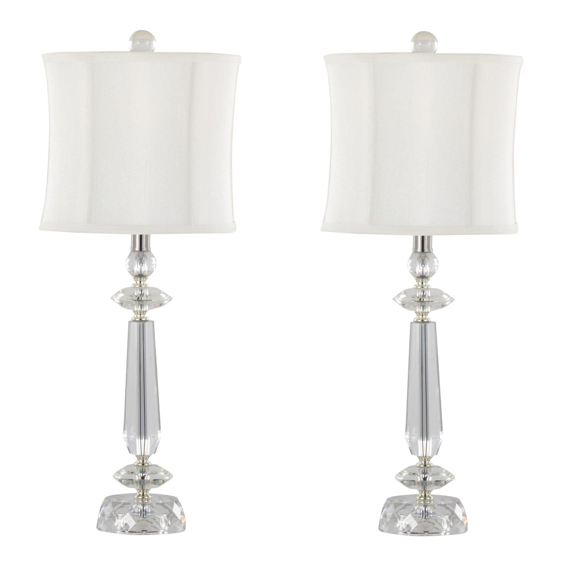 The Karat set includes two contemporary table lamps with sleek, tapered designs featuring clear crystal bases, chrome accents, and white softback shades, displayed against a plain background.