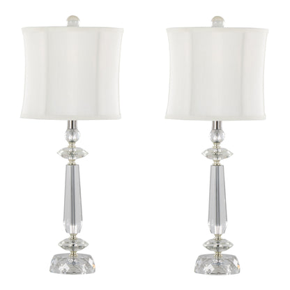 The Karat set includes two contemporary table lamps with sleek, tapered designs featuring clear crystal bases, chrome accents, and white softback shades, displayed against a plain background.