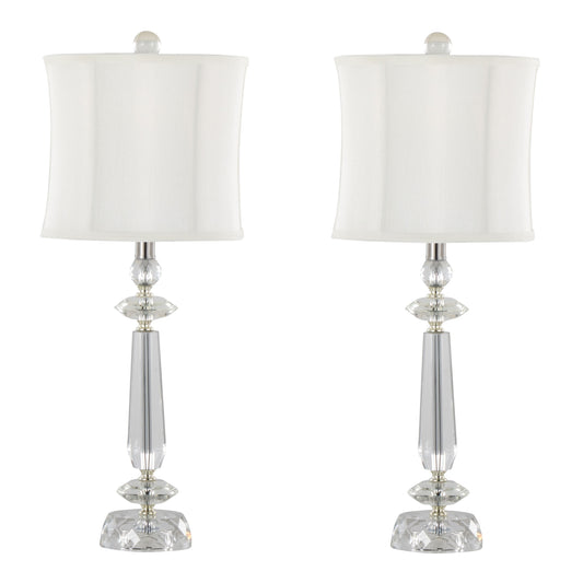 The Karat set includes two contemporary table lamps with sleek, tapered designs featuring clear crystal bases, chrome accents, and white softback shades, displayed against a plain background.