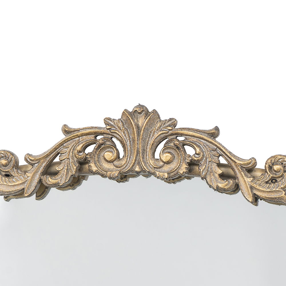The Arch Mirror, Baroque Inspired Wall Decor features an ornate gold frame with intricate leaf and scroll carvings at the top edge, adding elegant detail to your bathroom, bedroom, or living room.