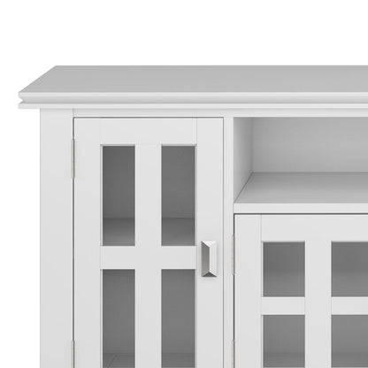 Close-up of the Artisan - TV Media Stand, showcasing white glass-paneled doors with silver handles, an upper shelf, and minimalist modern design elements.
