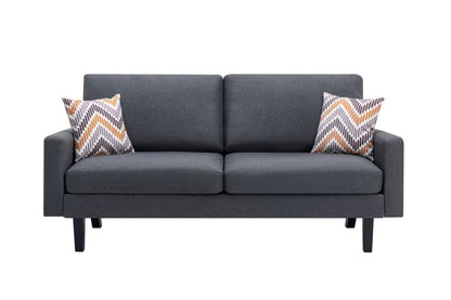 The Bahamas Minimalistic Sofa features a modern dark gray design with straight arms and wooden legs, accented by two orange, gray, and white chevron throw pillows. Shown against a white background.