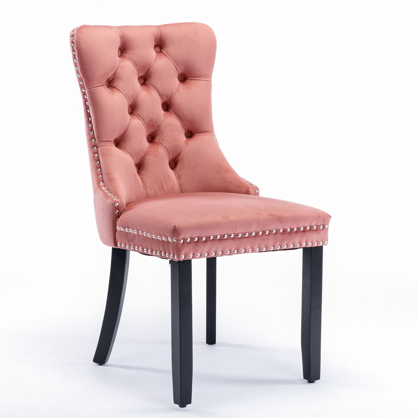 The Nikki set features modern, high-end velvet upholstered dining chairs with tufted backrests, solid wood legs, and silver nailhead trim, shown here in pink against a plain white background.