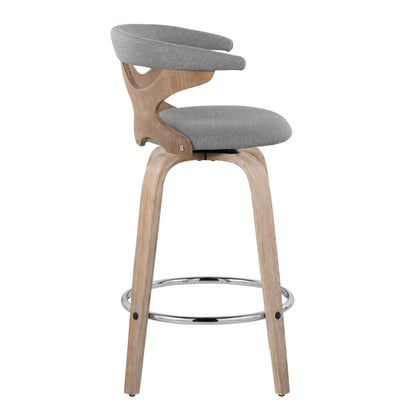 The Gardenia Mid Century Modern Fixed Height Counter Stool (Set of 2) features light wood legs, a circular chrome footrest, and a grey upholstered seat with a curved backrest, shown in profile view against a white background.