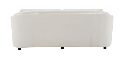 The Mariko Linen Sofa in beige, shown from the back, features a smooth, curved design with short black legs and includes 2 toss pillows.