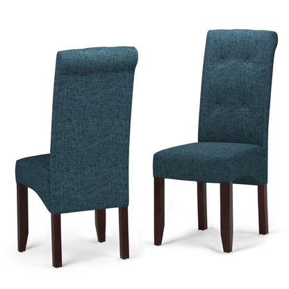 The Cosmopolitan Deluxe Tufted Parson Upholstered Chair set includes two chairs with teal fabric and dark wood legs. One chair shows the button-tufted front, while the other is angled to display the back and side.